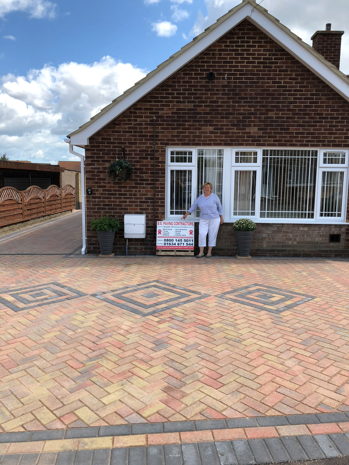Herringbone block paved driveway with decorative diamond detailing